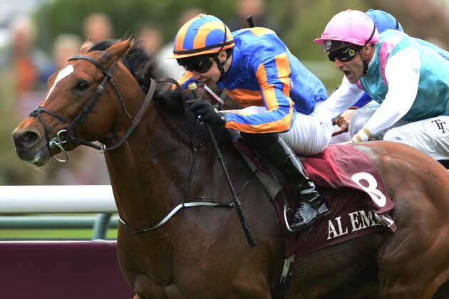 PARIS, FRANCE - OCTOBER 05:  Joseph O'Brien riding Gleneagles (L) past the post first but is disqualified and the win given to Thierry Thulliez riding Full Mast (pink cap) in The Qatar Prix Jean-Luc Lagardere at Longchamp racecourse on October 05, 2014 in Paris, France. (Photo by Alan Crowhurst/Getty Images)