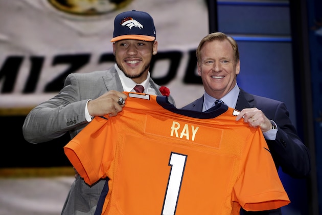 Shane Ray stands on stage with NFL commissioner Roger Goodell, right, after being drafted 23rd by the Denver Broncos during the first round of the 2015 NFL Draft, Thursday, April 30, 2015, in Chicago.  (Jeff Haynes/AP Images for Panini)