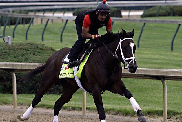 Kentucky Derby entrant Materiality, ridden by exercise rider Carlos Cano, gallops at Churchill Downs in Louisville, Ky., Thursday, April 30, 2015.  (AP Photo/Garry Jones)