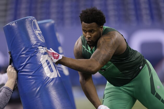 Auburn defensive lineman Angelo Blackson runs a drill at the NFL football scouting combine in Indianapolis, Sunday, Feb. 22, 2015. (AP Photo/David J. Phillip)