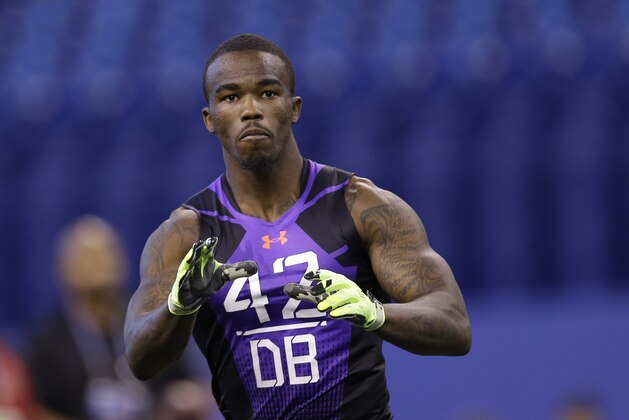 Louisville defensive back James Sample runs a drill at the NFL football scouting combine in Indianapolis, Monday, Feb. 23, 2015. (AP Photo/David J. Phillip)