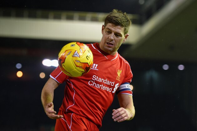LIVERPOOL, ENGLAND - JANUARY 20:  Steven Gerrard of Liverpool collects the ball during the Capital One Cup Semi-Final first leg match between Liverpool and Chelsea at Anfield on January 20, 2015 in Liverpool, England.  (Photo by Michael Regan/Getty Images)