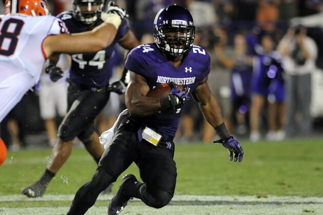 Northwestern's Ibraheim Campbell runs with an interception in the second half of an NCAA college football game against Syracuse in Evanston, Ill., Saturday, Sept. 7, 2013. (AP Photo/Matt Marton)