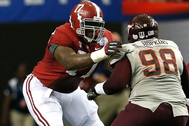 ATLANTA, GA - AUGUST 31:  Arie Kouandjio #77 of the Alabama Crimson Tide against Derrick Hopkins #98 of the Virginia Tech Hokies at Georgia Dome on August 31, 2013 in Atlanta, Georgia.  (Photo by Kevin C. Cox/Getty Images)