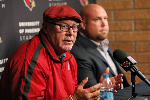 Arizona Cardinals head coach Bruce Arians, left, and G.M. Steve Keim speak during a news conference Tuesday, Feb. 24, 2015, in Tempe, Ariz. Both Keim and Arians were given contract extensions after their successful 2014 season. (AP Photo/Matt York)