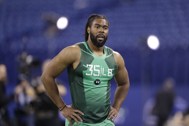 Georgia linebacker Ramik Wilson runs the 40-yard dash at the NFL football scouting combine in Indianapolis, Sunday, Feb. 22, 2015. (AP Photo/Julio Cortez)