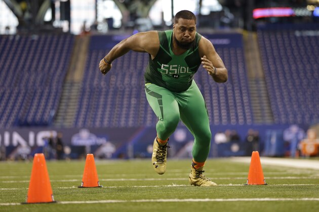 Auburn defensive lineman Gabe Wright runs a drill at the NFL football scouting combine in Indianapolis, Sunday, Feb. 22, 2015. (AP Photo/Julio Cortez)