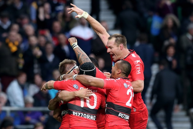 LONDON, ENGLAND - MAY 02:  Drew Mitchell (L-headband) of Toulon is congratulated by teammates after scoring his team's second try during the European Rugby Champions Cup Final match between ASM Clermont Auvergne and RC Toulon at Twickenham Stadium on May 2, 2015 in London, England.  (Photo by David Rogers/Getty Images)