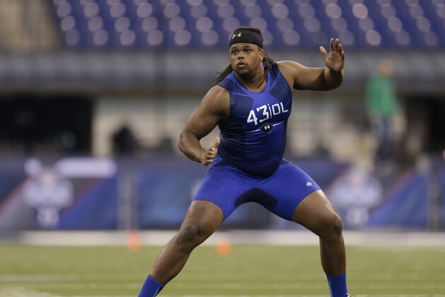 San Diego State offensive lineman Terry Poole runs a drill at the NFL football scouting combine in Indianapolis, Friday, Feb. 20, 2015. (AP Photo/David J. Phillip)