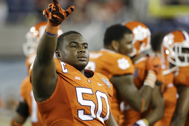 Clemson defensive tackle Grady Jarrett (50) waves to fans as he comes off the field during the final minutes of the Russell Athletic Bowl NCAA college football game against Oklahoma in Orlando, Fla., Monday, Dec. 29, 2014. Clemson won 40-6.(AP Photo/John Raoux)