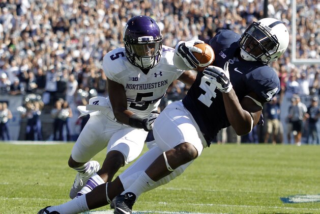 STATE COLLEGE, PA - SEPTEMBER 27:  Adrian Amos #4 of the Penn State Nittany Lions intercepts a pass to Miles Shuler #5 of the Northwestern Wildcats in the third quarter during the game on September 27, 2014 at Beaver Stadium in State College, Pennsylvania.  (Photo by Justin K. Aller/Getty Images)