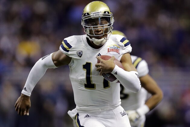 UCLA’s Brett Hundley (17) rushes for a touchdown against Kansas State during the first half of the Alamo Bowl NCAA college football game, Friday, Jan. 2, 2015, in San Antonio. (AP Photo/Eric Gay)