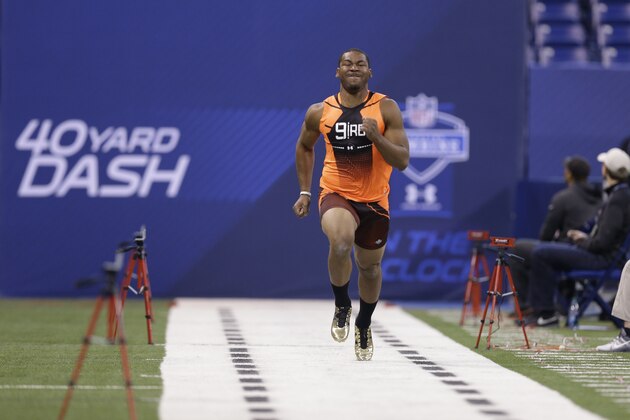 Minnesota running back David Cobb runs the 40-yard dash at the NFL football scouting combine in Indianapolis, Saturday, Feb. 21, 2015. (AP Photo/David J. Phillip)