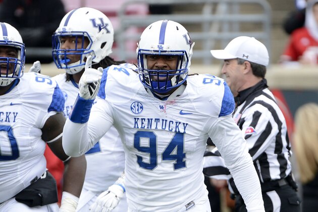 Nov 29, 2014; Louisville, KY, USA;  Kentucky Wildcats defensive end Za'Darius Smith (94) celebrates after sacking Louisville Cardinals quarterback Reggie Bonnafon (7) in the first quarter at Papa John's Cardinal Stadium. Mandatory Credit: Jamie Rhodes-USA TODAY Sports