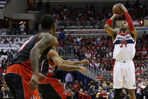 Apr 24, 2015; Washington, DC, USA; Washington Wizards forward Paul Pierce (34) shoots the ball as Toronto Raptors guard DeMar DeRozan (10) defends in the first quarter in game three of the first round of the NBA Playoffs at Verizon Center. Mandatory Credit: Geoff Burke-USA TODAY Sports