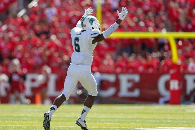 Tulane cornerback Lorenzo Doss (6) celebrates his interception against Rutgers during the third quarter of an NCAA college football game Saturday, Sept. 27, 2014, in Piscataway, N.J. (AP Photo/Rich Schultz)