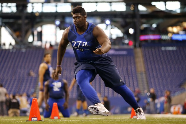 Texas A&M offensive lineman Jarvis Harrison runs a drill at the NFL football scouting combine in Indianapolis, Friday, Feb. 20, 2015. (AP Photo/Julio Cortez)
