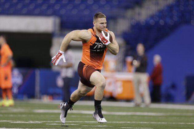 Rutgers running back Mike Burton runs a drill at the NFL football scouting combine in Indianapolis, Saturday, Feb. 21, 2015. (AP Photo/David J. Phillip)