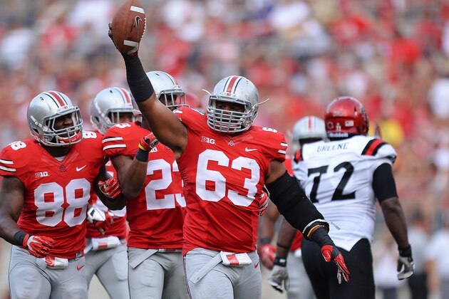 COLUMBUS, OH - SEPTEMBER 7:  Michael Bennett #63 of the Ohio State Buckeyes celebrates after recovering a fumble in the second quarter against the San Diego State Aztecs at Ohio Stadium on September 7, 2013 in Columbus, Ohio. Ohio State defeated San Diego State 42-7.  (Photo by Jamie Sabau/Getty Images)