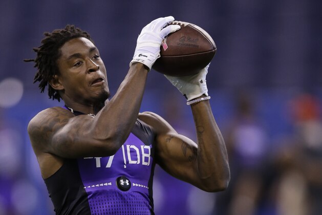 Towson defensive back Tye Smith runs a drill at the NFL football scouting combine in Indianapolis, Monday, Feb. 23, 2015. (AP Photo/Julio Cortez)