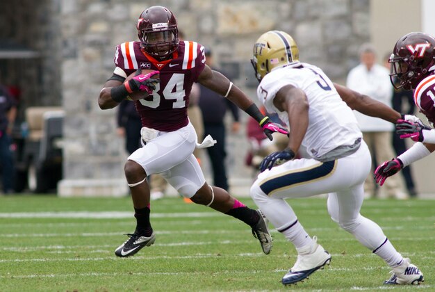Oct 12, 2013; Blacksburg, VA, USA; Virginia Tech Hokies safety Kyshoen Jarrett (34) returns a punt during the first quarter against the Pittsburgh Panthers at Lane Stadium. Mandatory Credit: Jeremy Brevard-USA TODAY Sports