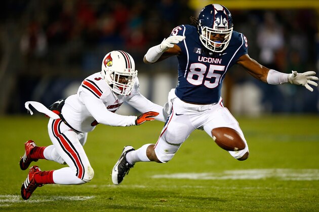 EAST HARTFORD, CT - NOVEMBER 08:  Geremy Davis #85 of the Connecticut Huskies misses a pass in front of Charles Gaines #3 of the Louisville Cardinals in the first quarter at Rentschler Field during the game on November 8, 2013 in East Hartford, Connecticut.  (Photo by Jared Wickerham/Getty Images)