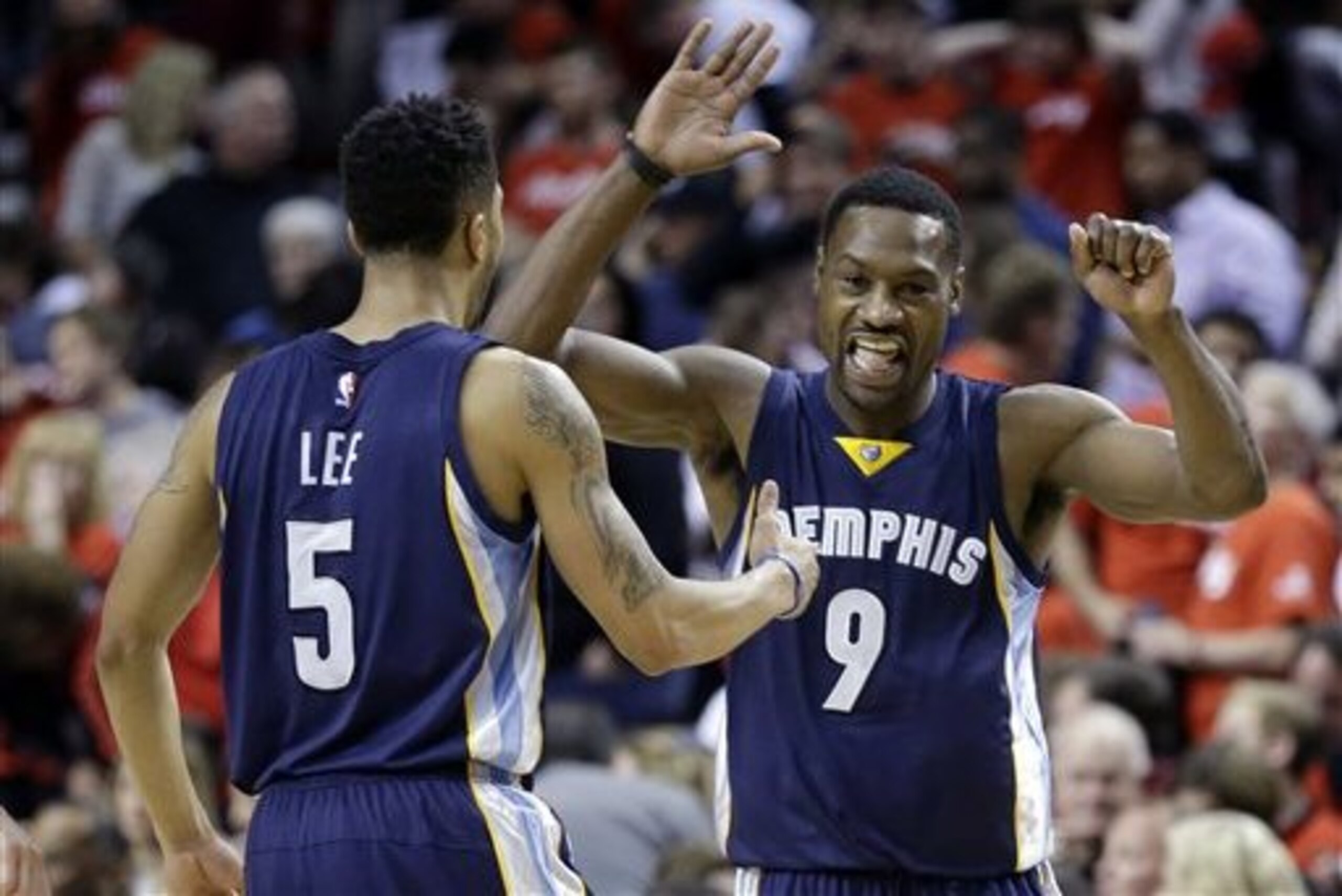 Memphis Grizzlies guard Tony Allen, right, celebrates with teammate Courtney Lee during the second half of Game 3 of a first-round NBA basketball playoff series against the Portland Trail Blazers in Portland, Ore., Saturday, April 25, 2015.  The Grizzlies won 115-109 to lead the series 3-0. (AP Photo/Don Ryan)
