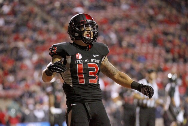 Nov 29, 2014; Fresno, CA, USA; Fresno State Bulldogs free safety Derron Smith (13) reacts after a play against the Hawaii Warriors in the fourth quarter at Bulldog Stadium. The Bulldogs defeated the Warriors 28-21. Mandatory Credit: Cary Edmondson-USA TODAY Sports