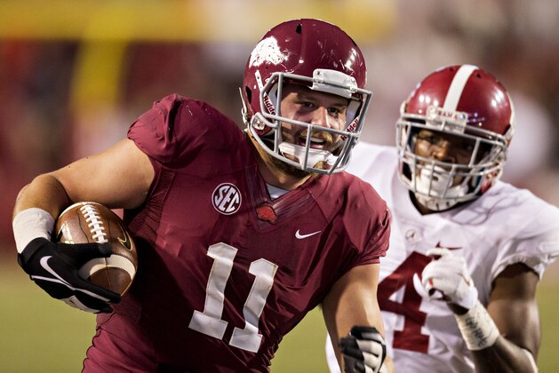 FAYETTEVILLE, AR - OCTOBER 11:  AJ Derby #11 of the Arkansas Razorbacks runs the ball for a touchdown past Eddie Jackson #4 of the Alabama Crimson Tide at Razorback Stadium on October 11, 2014 in Fayetteville, Arkansas.  The Crimson Tide defeated the Razorbacks 14-13.  (Photo by Wesley Hitt/Getty Images)