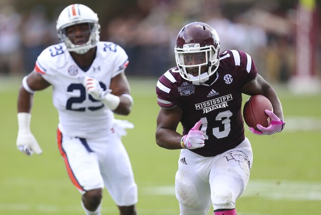 Oct 11, 2014; Starkville, MS, USA; (Editors note: Caption correction) Mississippi State Bulldogs running back Josh Robinson (13) carries the ball during the game against the Auburn Tigers at Davis Wade Stadium. Mandatory Credit: Spruce Derden-USA TODAY Sports
