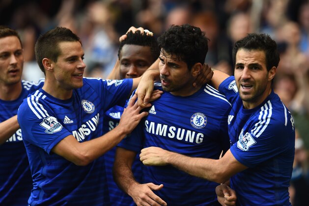 LONDON, ENGLAND - OCTOBER 05:  Diego Costa of Chelsea celebrates scoring their second goal with Cesar Azpilicueta and Cesc Fabregas of Chelsea during the Barclays Premier League match between Chelsea and Arsenal at Stamford Bridge on October 4, 2014 in London, England.  (Photo by Shaun Botterill/Getty Images)
