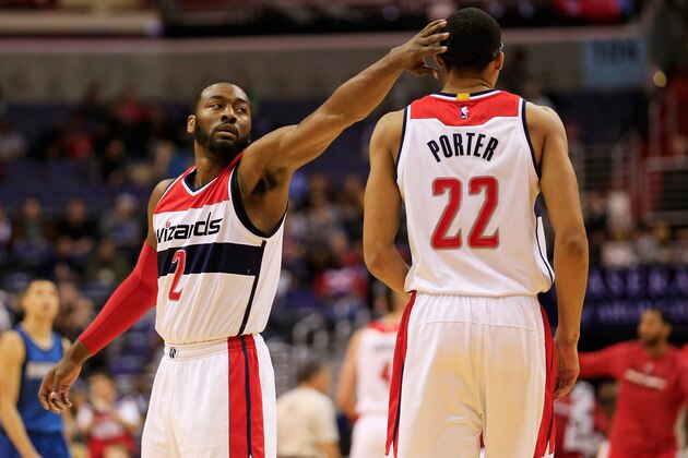 WASHINGTON, DC - DECEMBER 16: John Wall #2 and Otto Porter Jr. #22 of the Washington Wizards celebrate during the first half against the Minnesota Timberwolves at Verizon Center on December 16, 2014 in Washington, DC. NOTE TO USER: User expressly acknowledges and agrees that, by downloading and or using this photograph, User is consenting to the terms and conditions of the Getty Images License Agreement  (Photo by Rob Carr/Getty Images)