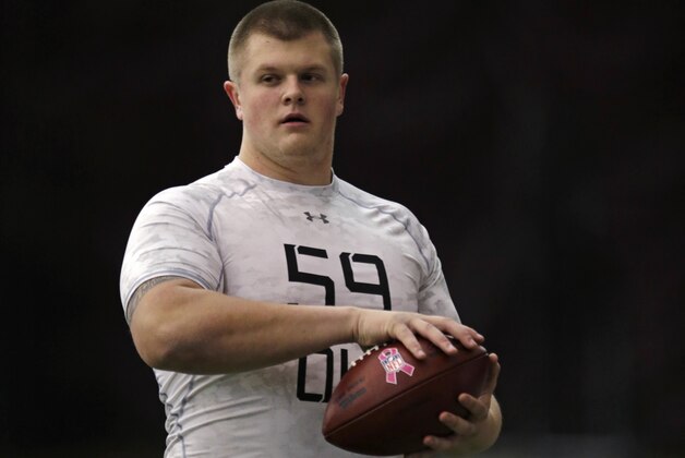 Boston College center Andy Gallik cradles the ball during an Pro Day for NFL football scouts at Boston College in Boston, Wednesday, March 18, 2015. (AP Photo/Charles Krupa)