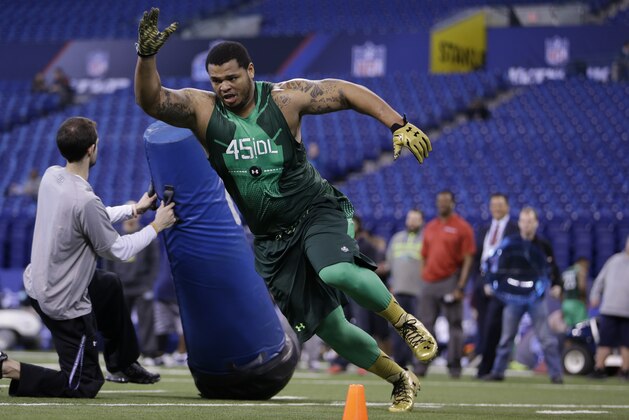 Northwestern State defensive lineman Deon Simon runs a drill at the NFL football scouting combine in Indianapolis, Sunday, Feb. 22, 2015. (AP Photo/Julio Cortez)