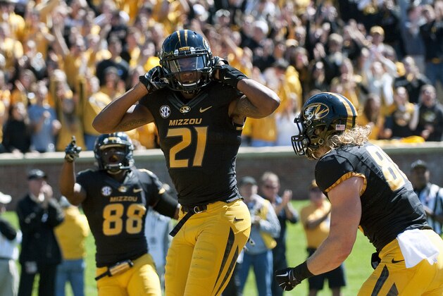 Missouri wide receiver Bud Sasser, center, celebrates with teammates Jimmie Hunt, left, and Sean Culkin, right, after Sasser scored on a 21-yard reception during the third quarter of an NCAA college football game against Central Florida, Saturday, Sept. 13, 2014, in Columbia, Mo. (AP Photo/L.G. Patterson)