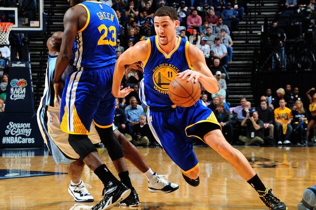 MEMPHIS, TN - DECEMBER 16: Klay Thompson #11 of the Golden State Warriors drives to the basket against the Memphis Grizzlies during the game on December 16, 2014 at the FedEx Forum in Memphis, Tennessee.  NOTE TO USER: User expressly acknowledges and agrees that, by downloading and/or using this Photograph, user is consenting to the terms and conditions of the Getty Images License Agreement. Mandatory Copyright Notice: Copyright 2014 NBAE (Photo by Scott Cunningham/NBAE via Getty Images)