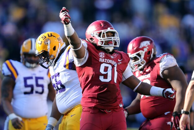 Nov 29, 2013; Baton Rouge, LA, USA; Arkansas Razorbacks defensive tackle Darius Philon (91) celebrates a sack by a teammate agains thte LSU Tigers in the first half at Tiger Stadium. Mandatory Credit: Crystal LoGiudice-USA TODAY Sports