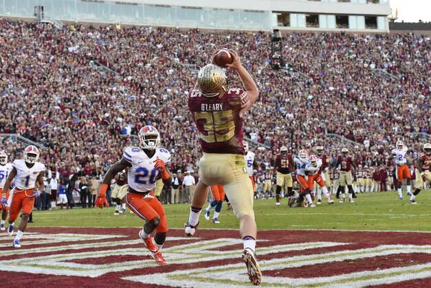 Nov 29, 2014; Tallahassee, FL, USA; Florida State Seminoles tight end Nick O'Leary (35) catches a pass for a touchdown in front of Florida Gators defensive back Marcus Maye (20) during the second quarter at Doak Campbell Stadium. Mandatory Credit: Tommy Gilligan-USA TODAY Sports