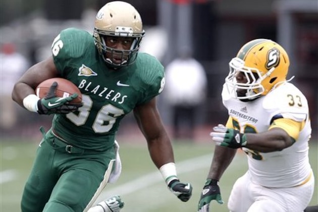 UAB tight end Kennard Backman (86) runs for a first down on a pass reception, past Southeastern Louisiana defender Kaleb Muse (33) during the first half of an NCAA college football game Saturday, Oct. 6, 2012, in Birmingham, Ala. (AP Photo/ Butch Dill) UAB tight end Kennard Backman (86) runs for a first down on a pass reception, past Southeastern Louisiana defender Kaleb Muse (33) during the first half of an NCAA college football game Saturday, Oct. 6, 2012, in Birmingham, Ala. (AP Photo/ Butch Dill)