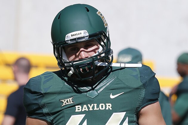 Baylor linebacker Bryce Hager (44) takes practice reps before a  NCAA college football game against Kansas, Saturday, Nov. 1, 2014, in Waco, Texas. (AP Photo/ Jerry Larson)