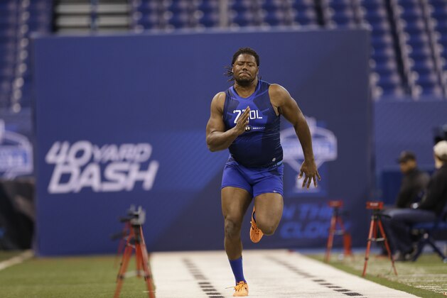 Virginia Tech offensive lineman Laurence Gibson runs the 40-yard dash at the NFL football scouting combine in Indianapolis, Friday, Feb. 20, 2015. (AP Photo/David J. Phillip)