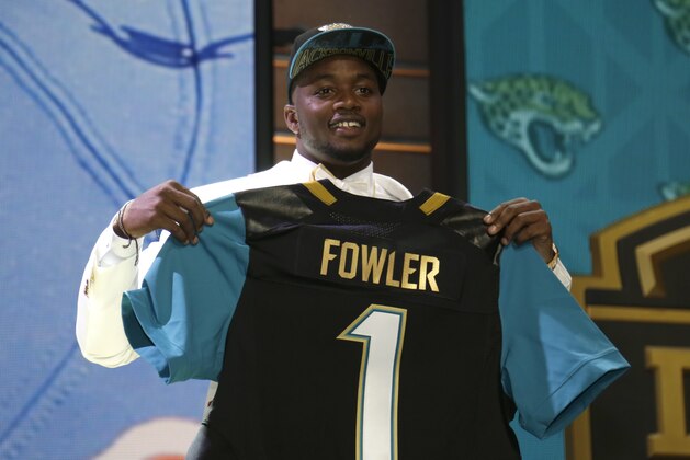 Dante Fowler stands on stage after being drafted third by Jacksonville in the first round of the 2015 NFL Draft, Thursday, April 30, 2015, in Chicago.  (Jeff Haynes/AP Images for Panini)