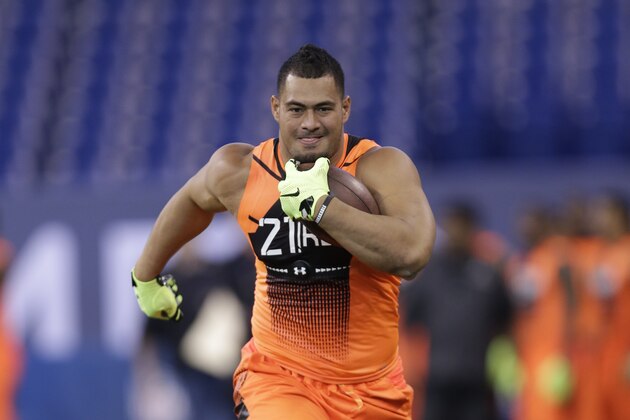 Hawaii running back Joey Iosefa runs a drill at the NFL football scouting combine in Indianapolis, Saturday, Feb. 21, 2015. (AP Photo/David J. Phillip)