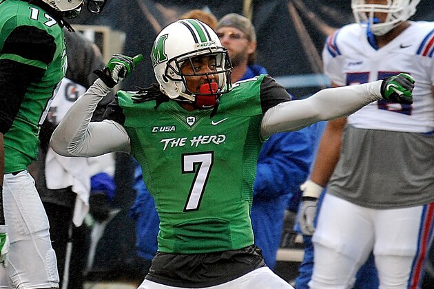 Marshall's Darryl Roberts (7) celebrates the Conference USA championship NCAA college football game against Louisiana Tech in Huntington, W.Va., Saturday Dec. 6, 2014. (AP Photo/Chris Tilley)