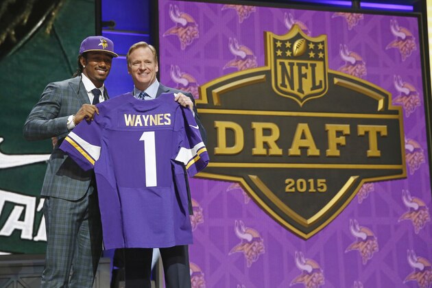 Michigan State defensive back Trae Waynes poses for photos with NFL commissioner Roger Goodell after being selected by the Minnesota Vikings as the 11th pick in the first round of the 2015 NFL Draft,  Thursday, April 30, 2015, in Chicago. (AP Photo/Charles Rex Arbogast)