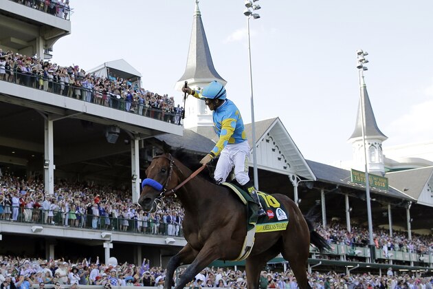 Victor Espinoza rides American Pharoah to victory in the 141st running of the Kentucky Derby horse race at Churchill Downs Saturday, May 2, 2015, in Louisville, Ky. (AP Photo/David J. Phillip)