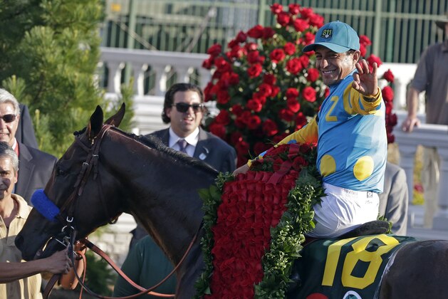 Victor Espinoza rides American Pharoah to victory in the 141st running of the Kentucky Derby horse race at Churchill Downs Saturday, May 2, 2015, in Louisville, Ky. (AP Photo/Brynn Anderson)