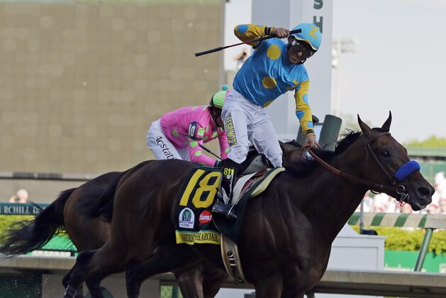 Victor Espinoza rides American Pharoah to victory in the 141st running of the Kentucky Derby horse race at Churchill Downs Saturday, May 2, 2015, in Louisville, Ky. (AP Photo/Brynn Anderson)
