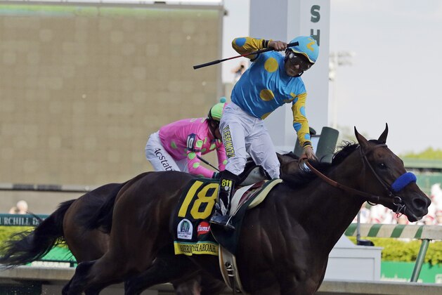 Victor Espinoza rides American Pharoah to victory in the 141st running of the Kentucky Derby horse race at Churchill Downs Saturday, May 2, 2015, in Louisville, Ky. (AP Photo/Brynn Anderson)