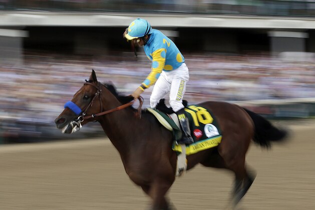 Victor Espinoza rides American Pharoah to victory in the 141st running of the Kentucky Derby horse race at Churchill Downs Saturday, May 2, 2015, in Louisville, Ky. (AP Photo/Tim Donnelly)